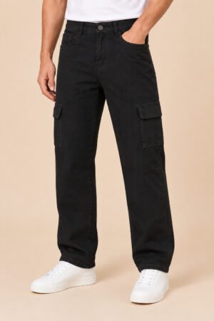 Men's wide leg cargo jeans in jet black, worn with white sneakers