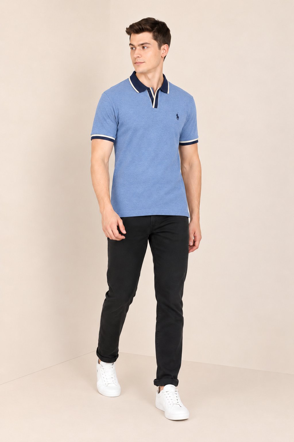 Model wearing a heather blue short-sleeve polo with navy contrast trim, full-length view